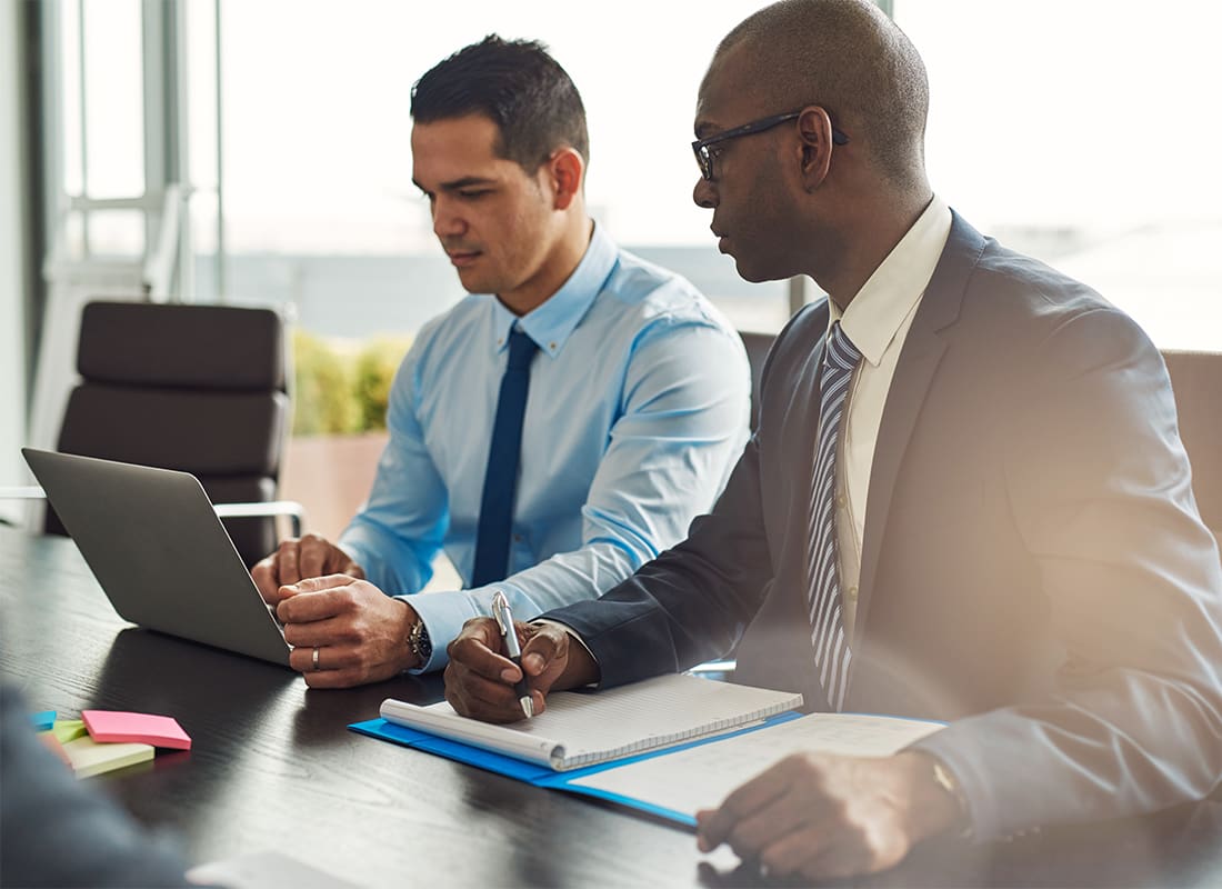 Business Insurance - Two Experienced Business Executives in a Meeting