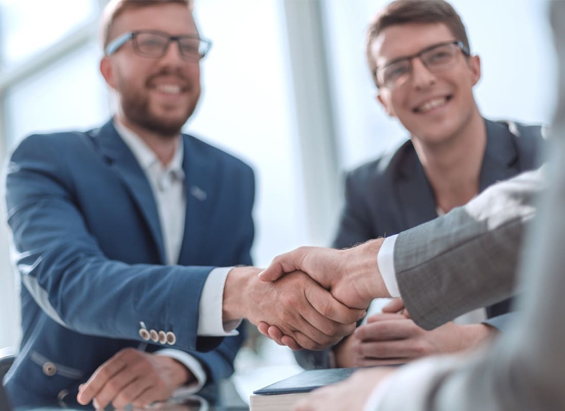 Idaho Companies We Insure- close up. successful business people shaking hands
