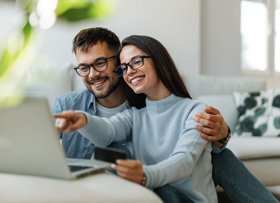 Read Our Reviews - Both Looking at Laptop, Reading One Order